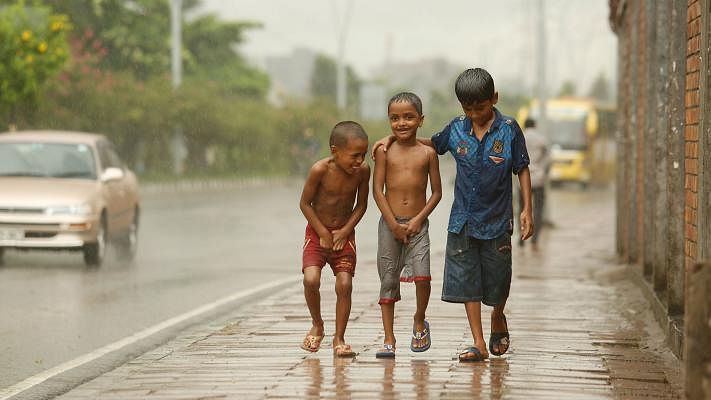 Children have had fun in the rain in Hatirjheel, Dhaka on 15 July. The moment has been captured by Sumon Yusuf.