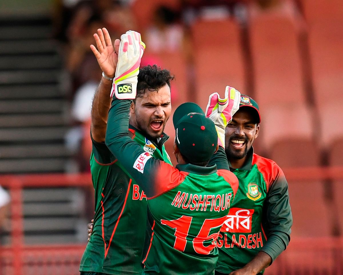 Mashrafe Mortaza (L) inspired Bangladesh to a 48-run win on Sunday. AFP