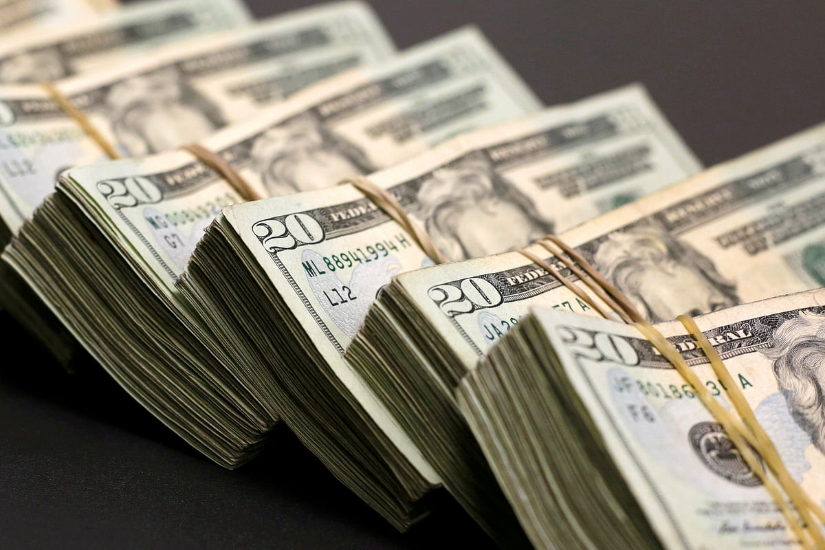 Bundles of banknotes of US dollar. Photo: Reuters