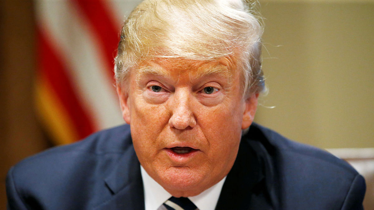 US president Donald Trump speaks about his summit meeting with Russian president Vladimir Putin as he begins a meeting with members of the US Congress at the White House in Washington on 17 July. Photo: Reuters