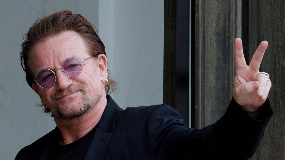 Singer Bono of Irish band U2 and co-founder of ONE organisation waves as he arrives at the Elysee Palace in Paris, France, 24 July, 2017. Photo: Reuters