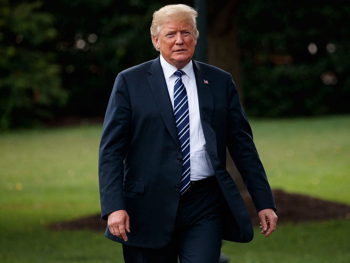 US president Donald Trump arrives for a tour during a `Made in America Product Showcase` at the White House on 23 July in Washington. Photo: AP