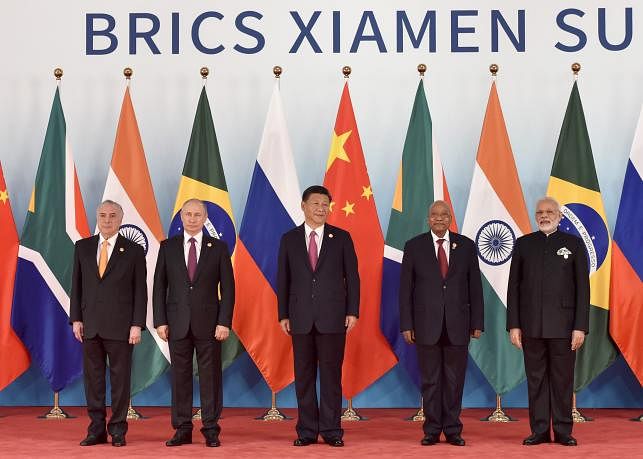 (L-R) Brazil’s President Michel Temer, Russian President Vladimir Putin, Chinese President Xi Jinping, South Africa’s President Jacob Zuma and Indian Prime Minister Narendra Modi pose for a group photo during the BRICS Summit at the Xiamen International Conference and Exhibition Center in Xiamen, China. Photo: AFP