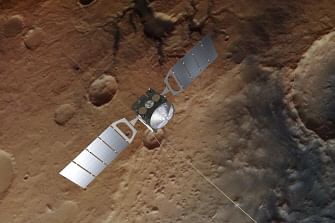 This photo obtained from the European Space Agency (ESA) on 25 July 2018, shows an artist`s impression of the Mars Express spacecraft over a background based on an actual image of Mars taken by the spacecraft`s high resolution stereo camera. Photo: AFP