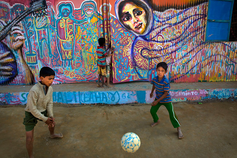 In this 21 January photo, Rohingya refugee children kick a football outside their makeshift school in the Kutupalong refugee camp near Cox`s bazar, Bangladesh.Photo: AP