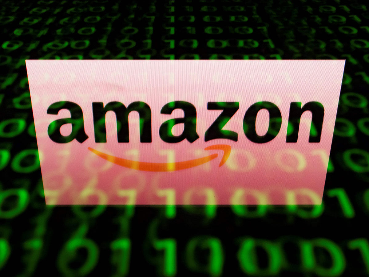 In this file photo taken on 28 April 2018 shows the logo of Amazon displayed on a screen and reflected on a tablet in Paris. Photo: AFP