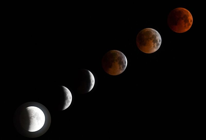 A combo of six pictures shows a `blood moon` total lunar eclipse in Bishkek late on 27 July 2018. Photo: AFP