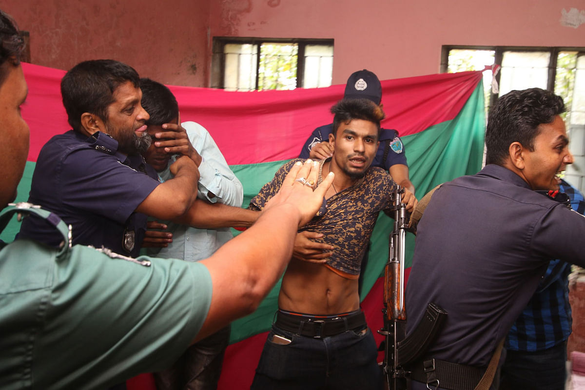 Police break into  a polling station and arrest miscreants stamping ballots at Sylhet Railway Government Primary School polling centre on 30 July. Photo: Abdus Salam