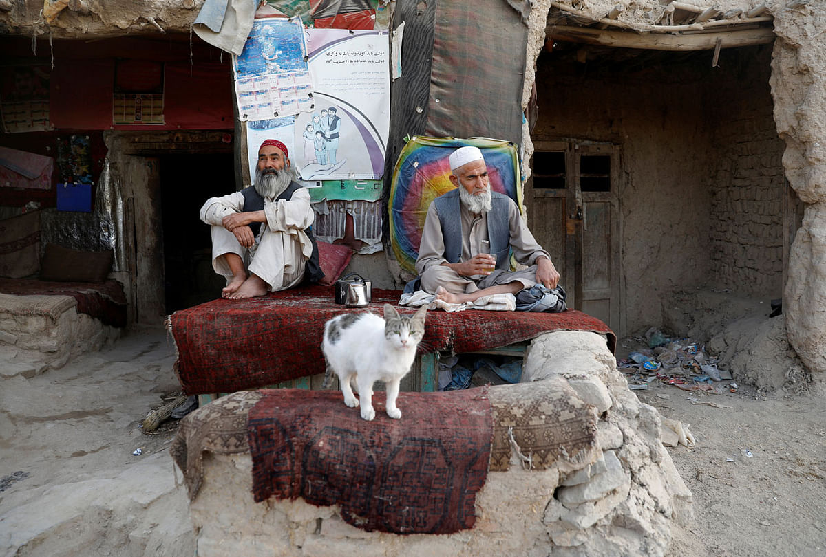 Afghan men drink tea outside a tea shop in Kabul, Afghanistan on 30 July. Photo: Reuters