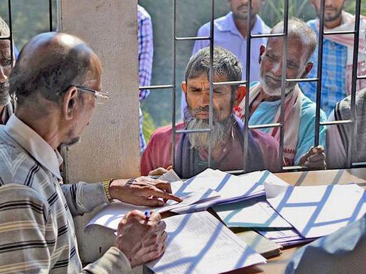 Concerned residents of Assam come to see if they have been dropped from the draft list of citizens. Photo: AFP