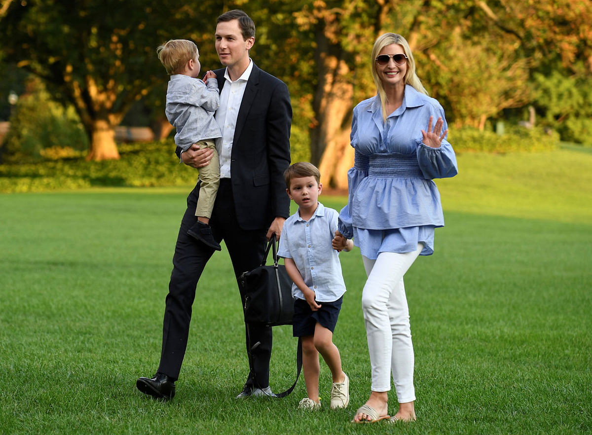 US president Donald Trump`s daughter and advisor Ivanka (R) walks with husband Jared Kushner who holds son Theodore as they exit Marine One helicopter, returning from a weekend with Trump at his Bedminister, New Jersey golf club, to the White House, Washington, DC, US on 29 July. Photo: Reuters