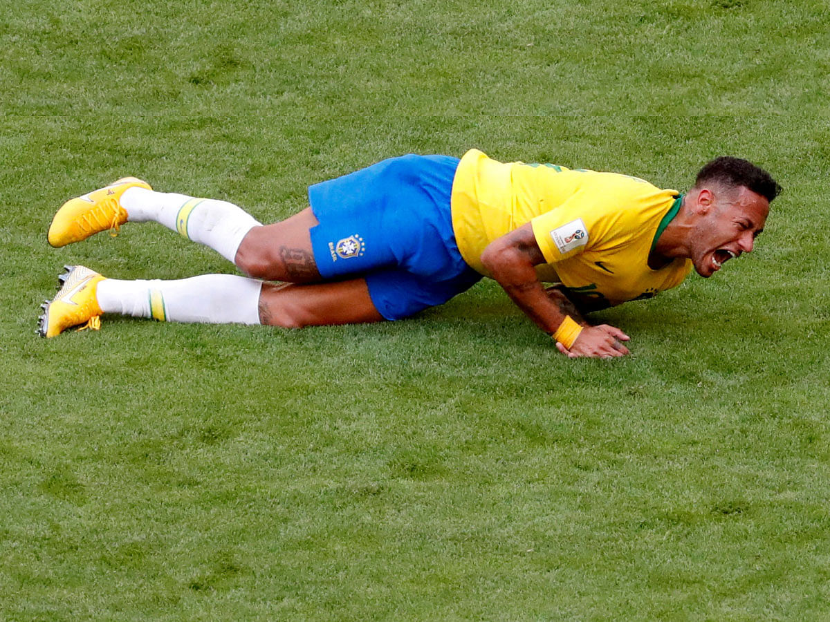 Brazil`s Neymar lies on the pitch in World Cup match against Mexico on 2 July. Photo: Reuters