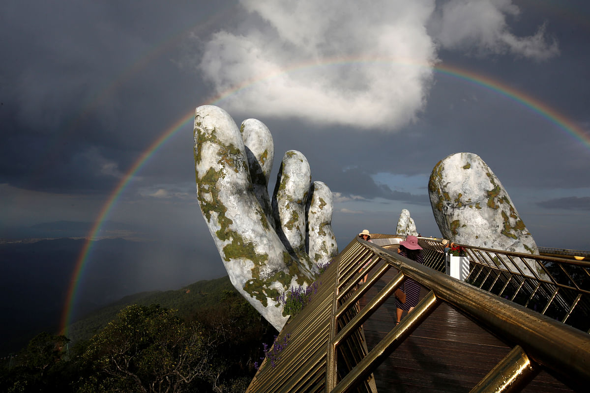 A double rainbow appears above giant hands structure on the Gold Bridge on Ba Na hill near Danang city, Vietnam, on 1 August 2018. Photo: Reuters