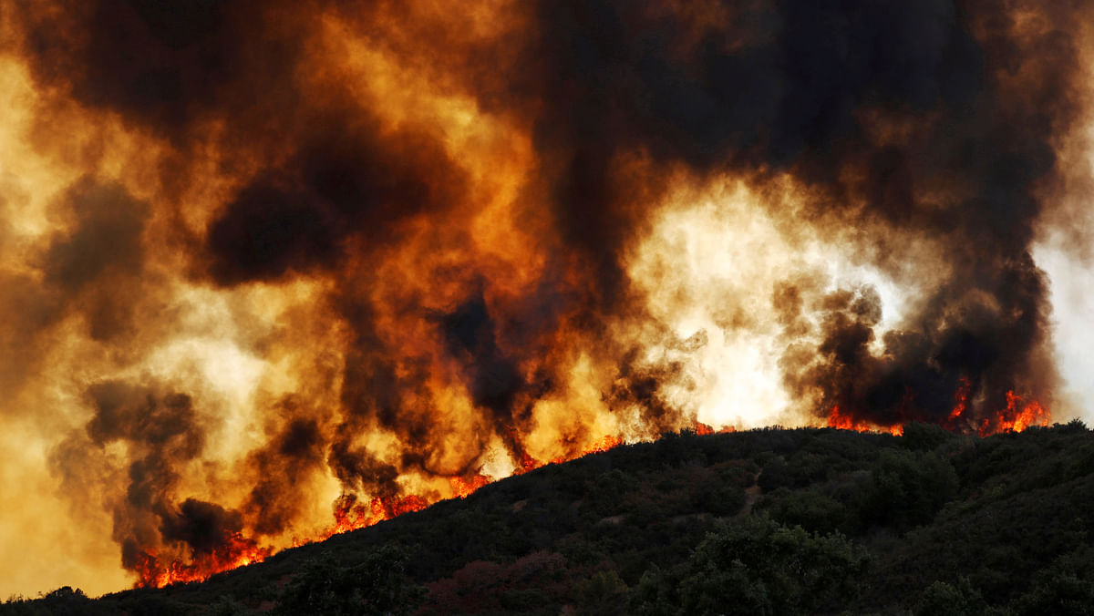 Wind-driven flames roll over a hill towards homes during the River Fire (Mendocino Complex) near Lakeport, California, US on 2 August 2018. Photo: Reuters