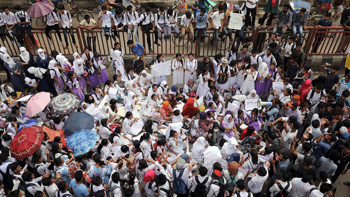 Students blockade a road as they take part in a protest over recent traffic accidents that killed a boy and a girl, in Dhaka. Reuters