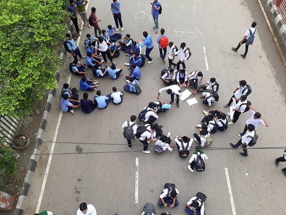 Students take position on road at Science Laboratory intersection, Dhaka on 4 August 2018 in a protest demanding safe road. The protest sparked off following the death of two students in a road crash in the city on 29 July. Photo: Suhada Afrin