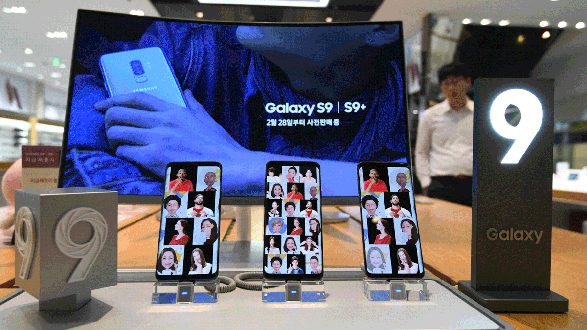 A man walks past a display for Samsung Galaxy S9 smartphones at the company`s showroom in Seoul on 31 July 2018. Photo: AFP