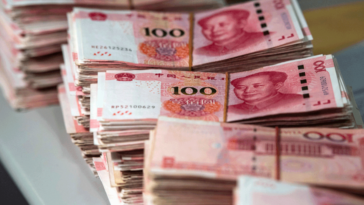 Bundles of 100 yuan (14.6 USD) notes are pictured at a bank in Shanghai on 8 August 2018. A rally in Asian markets stuttered on August 8, with early gains pared as the US-China trade row erodes investor confidence. But the yuan got some support after a news report said the Chinese central bank had emphasised the need for currency stability to the country`s lenders as it looks to halt a slide in recent months. -- AFP