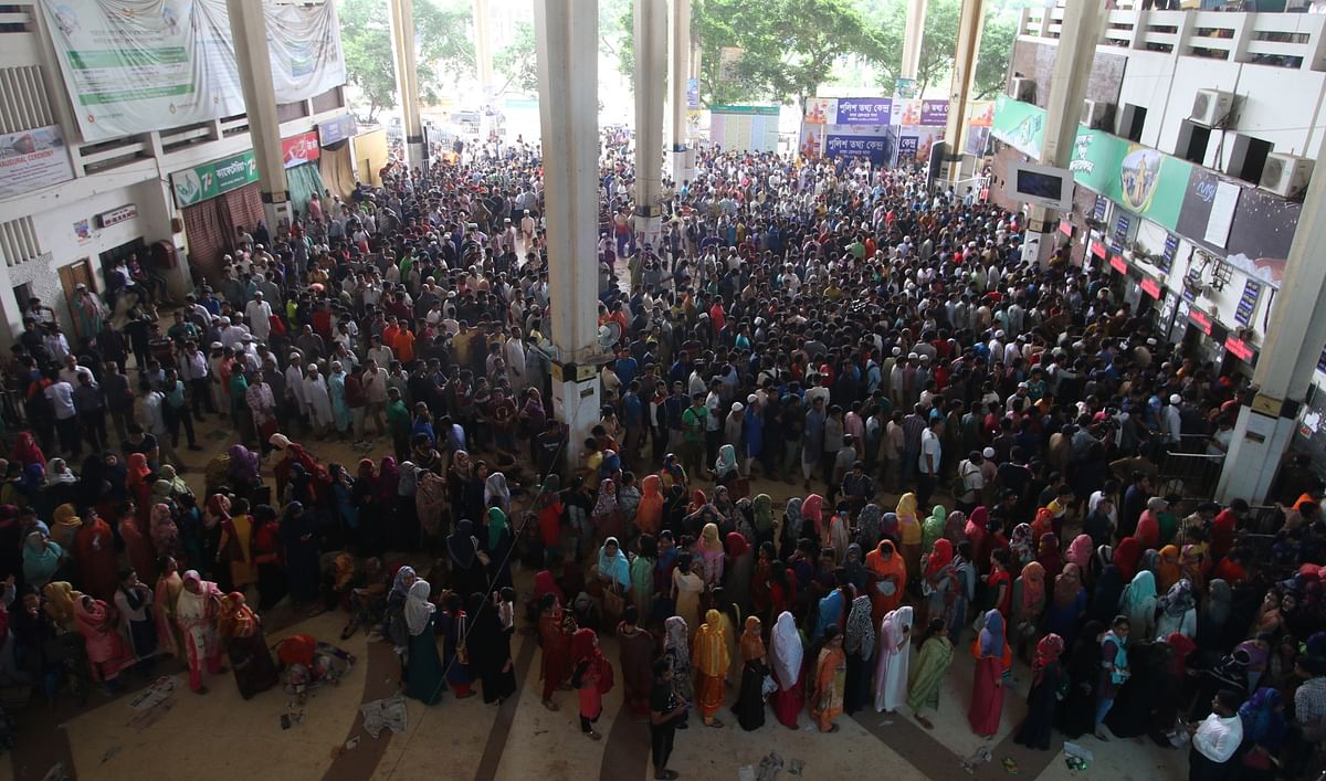 Hundreds of people gather in Kamalapur Railway Station, Dhaka to collect tickets as selling of advance train tickets for Eid ul-Azha journey begins on Wednesday morning. The authorities on Wednesday (8 August) are selling tickets scheduled for 17 August. Photo: Abdus Salam