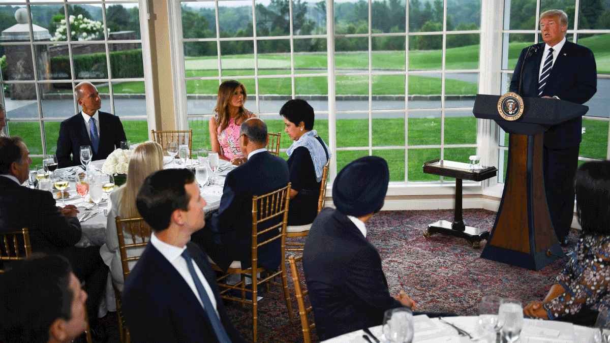 US president Donald Trump (R) speaks, flanked by first lady Melania Trump (2nd L), Boeing CEO Dennis Muilenburg (L) and CEO of PepsiCo Indra Nooyi (3rd L), during a dinner with business leaders in Bedminster, New Jersey, on 7 August 2018. -- AFP