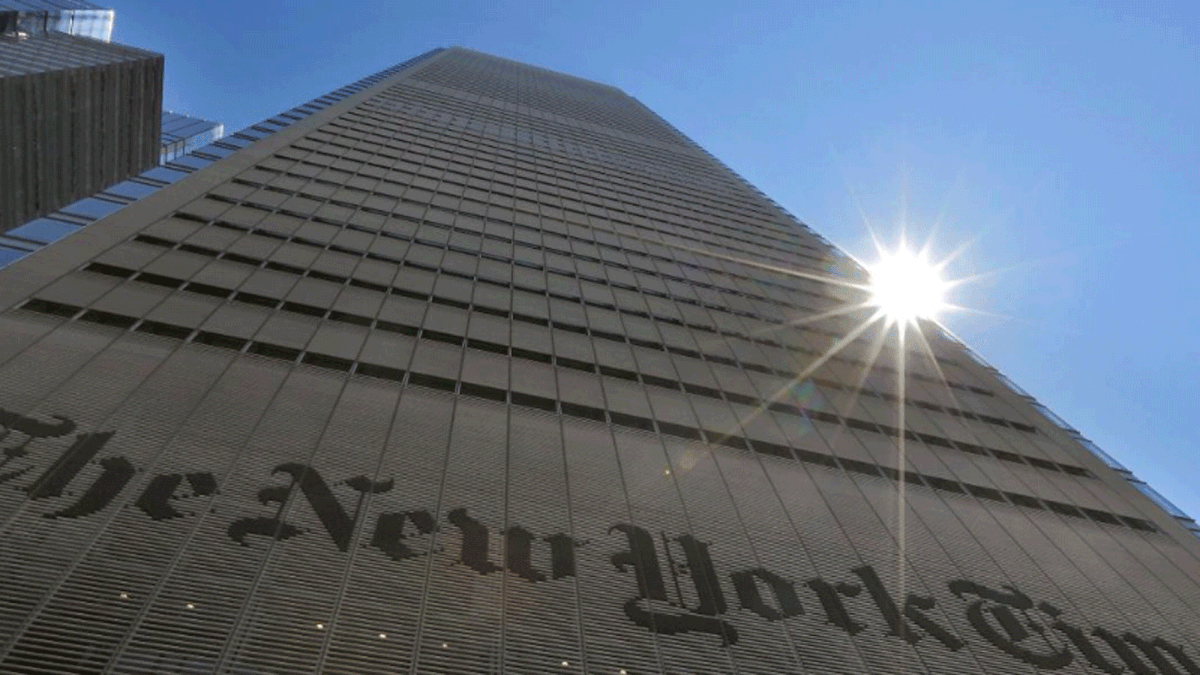The sun peaks over the New York Times Building in New York, US, on 14 August 2013. -- Reuters