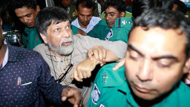 Detective Branch of police produces Shahidul Alam, who was picked up by plainclothes men earlier, before a Dhaka court Monday. Photo: Shuvra Kanti Das