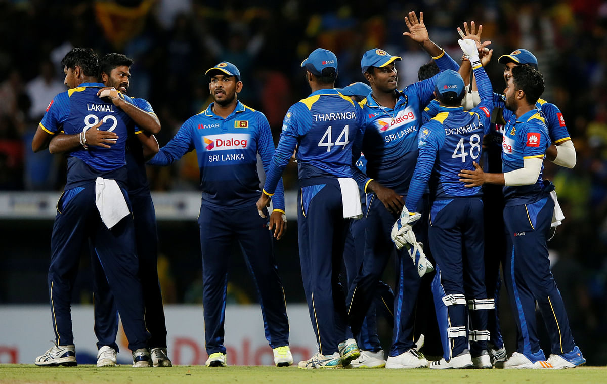 Sri Lanka`s captain Angelo Mathews celebrates with his team members after they won the match against South Africa in the fourth One Day International at Pallekele, Sri Lanka on 8 August 2018. Photo: Reuters