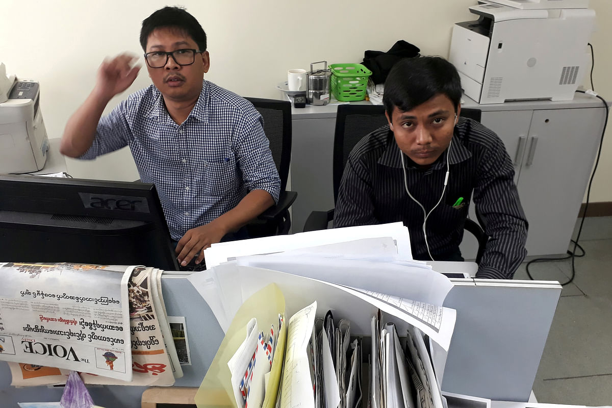 Reuters journalists Wa Lone and Kyaw Soe Oo pose for a picture at the Reuters office in Yangon, Myanmar. Reuters