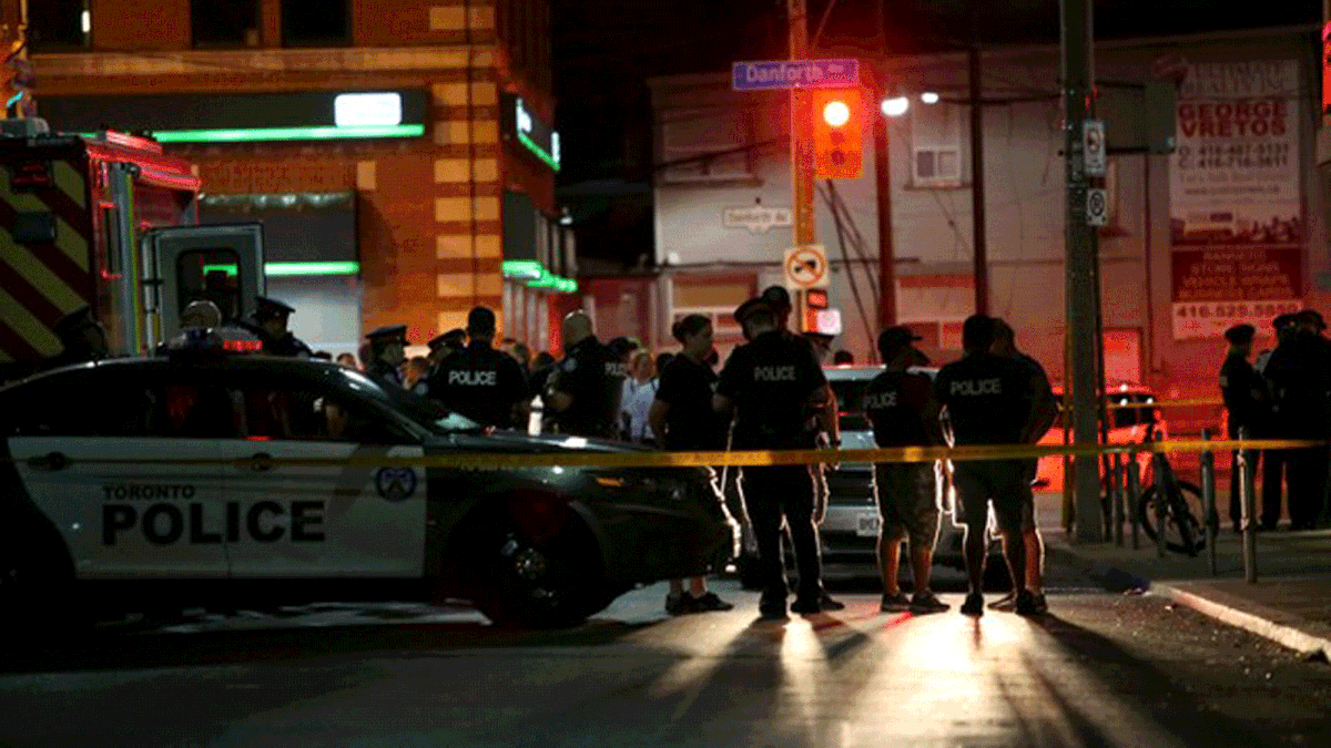 Police are seen near the scene of a mass shooting in Toronto, Canada, 22 July 2018. Photo: Reuters