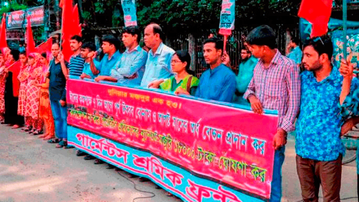 Readymade garment workers on Friday stage demonstration infront of the Jatiya Press Club in Dhaka demanding payment of Eid bonus and salary seven days before Eid-ul-Azha. Photo: UNB