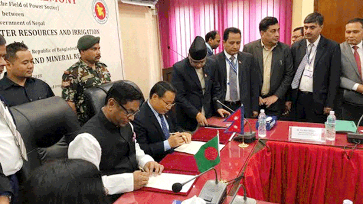 State minister for Power, Energy and Mineral Resources ministry Nasrul Hamid and his Nepalese counter is signing a Memorendum of Understanding (MoU) over the cooperation in power sector in Kathmandu on Friday. Photo: BSS
