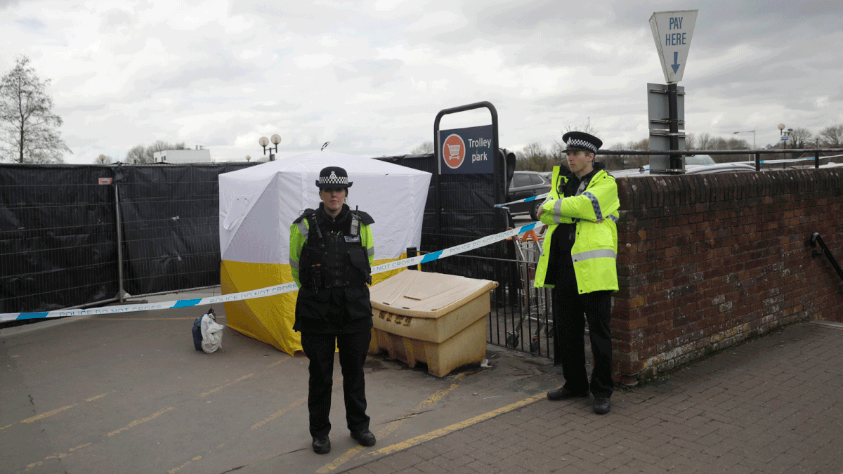 In this 13 March, 2018, file photo, police officers guard a cordon around a police tent covering a supermarket car park pay machine near the spot where former Russian spy Sergei Skripal and his daughter were found critically ill following exposure to the Russian-developed nerve agent Novichok in Salisbury, England. Photo: AP