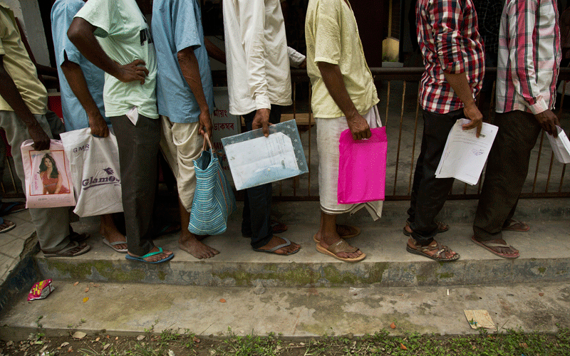 People whose names were left out in the National Register of Citizens (NRC) draft stand in a queue to collect forms to file appeals in Mayong, 45 kilometers (28 miles) east of Gauhati, India on 10 August. Photo: AP