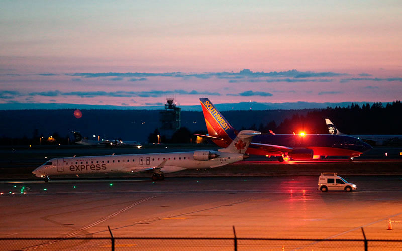 Planes sit on the tarmac at Sea-Tac International Airport after service was halted after an Alaska Airlines plane was stolen on 10 August in Washington. Photo: AP