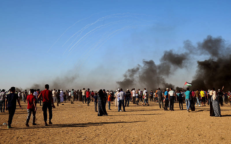 Palestinian protestors gather during a demonstration at the Israel-Gaza border, east of Khan Yunis in the southern Gaza Strip, on 10 August. Photo: AFP