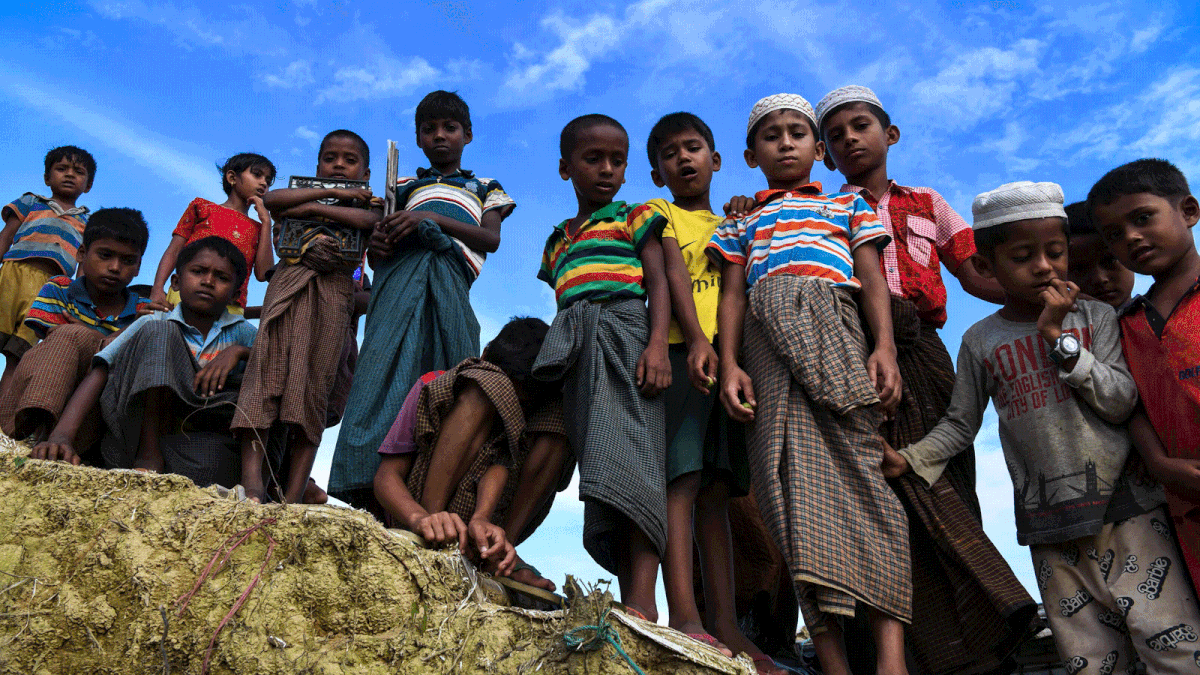 Rohingya refugee children look on at the Kutupalong camp in Ukhia near Cox`s Bazar on 12 August 2018. Nearly 700,000 Rohingya fled Myanmar`s Rakhine state last year to escape a violent military crackdown. The United Nations has described the army purge against the persecuted minority as ethnic cleansing, and thousands of Rohingya Muslims were believed to have been slaughtered in the pogrom that began last August. -- AFP
