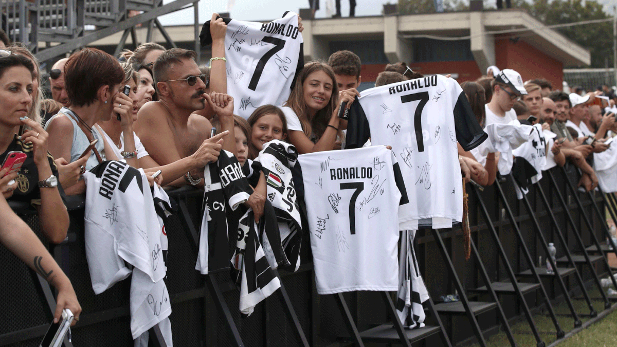 Juventus` supporters show Cristano Ronaldo T-shirts during the friendly football match between Juventus A and Juventus B at Villar Perosa, on 12 August 2018 at Villar Perosa. AFP