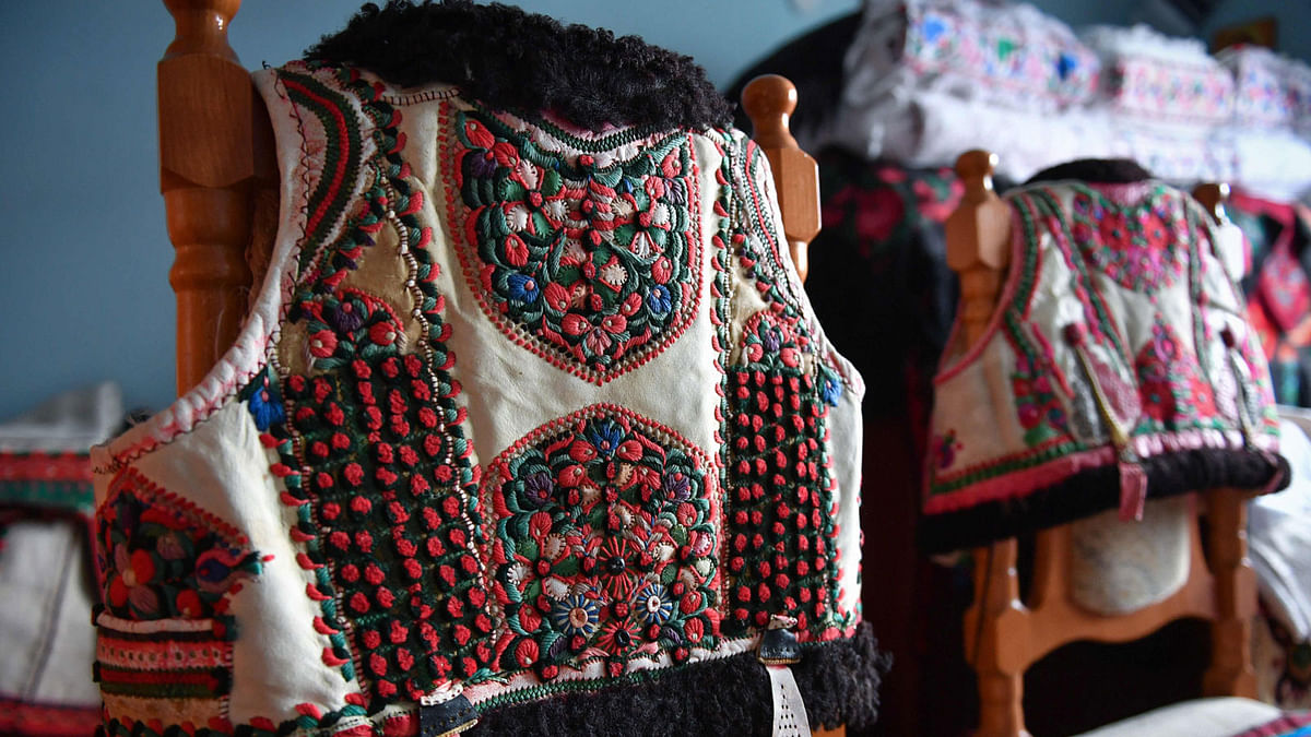 Traditional outfits from the Bihor northwestern region of Romania are displayed in Beius, Romania on 17 July. Photo: AFP