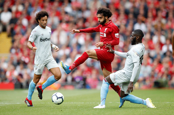 Liverpool`s Mohamed Salah in action with West Ham`s Arthur Masuaku. Photo: Reuters