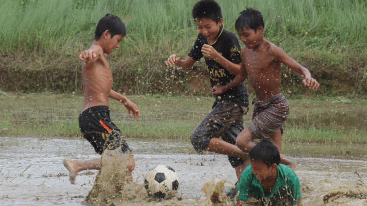 Children playing football. Photo: Nerob Chowdhury