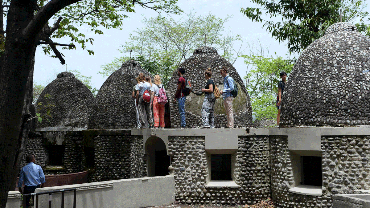 This picture taken on 18 June, 2018 shows tourists visiting the site of the now-derelict ashram visited by the Beatles 50 years ago, in Rishikesh in northern India. Photo: AFP