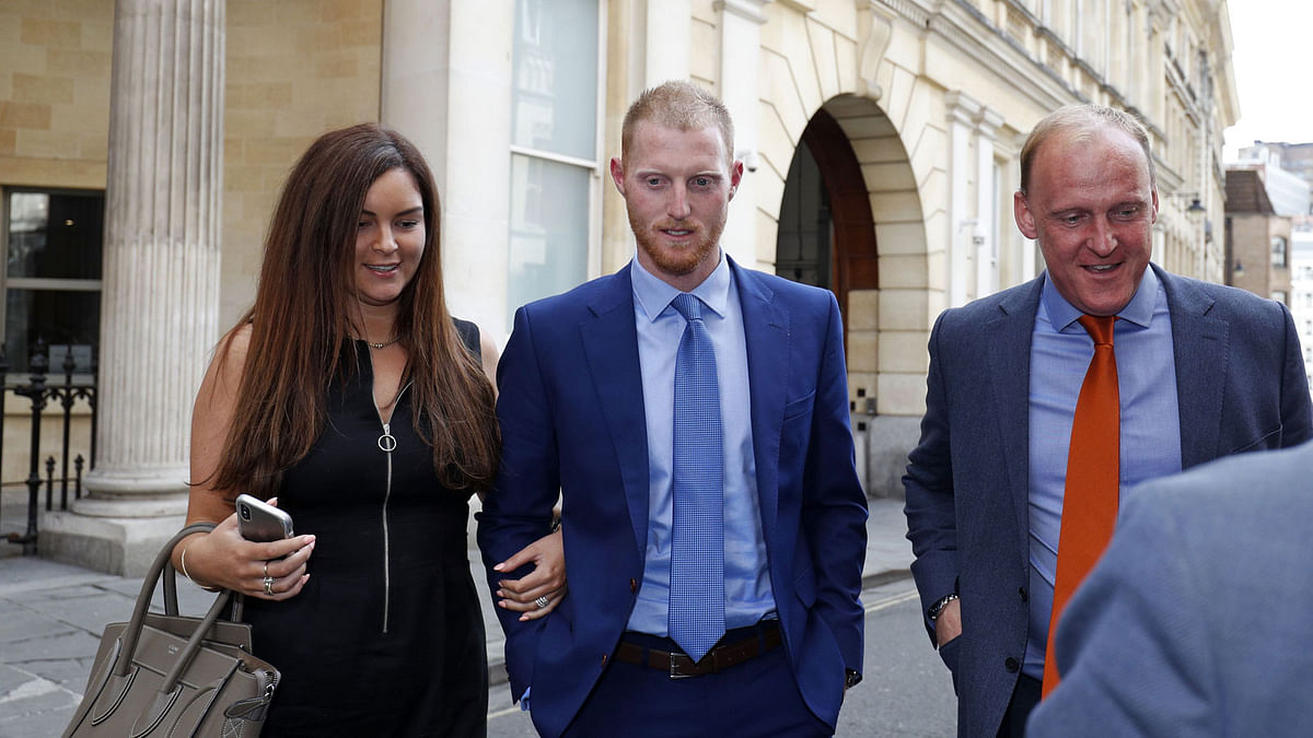 England cricketer Ben Stokes (C) and his wife Clare (L) leave Bristol Crown Court as the trial breaks for the day, in Bristol, south-west England on 13 August 2018, during his trial on charges of affray. -- AFP