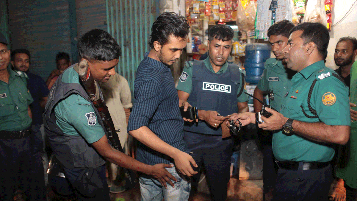 Police search a man during an anti drug raid in Dhaka, Bangladesh, 4 June, 2018. Photo: Reuters