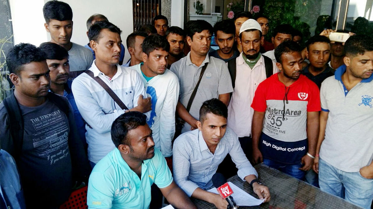 Some 50 Bangladeshi workers representing 270 victims lodged a police report and held a press conference in Kuala Lumpur on Sunday. -- Photo: New Straits Times