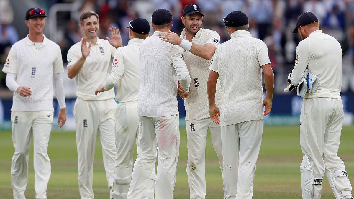 England’s James Anderson (3R) celebrates with teammates after winning the second Test cricket match between England and India at Lord’s Cricket Ground in London on 12 August, 2018. Photo: AFP  England crush India, lead series 2-0