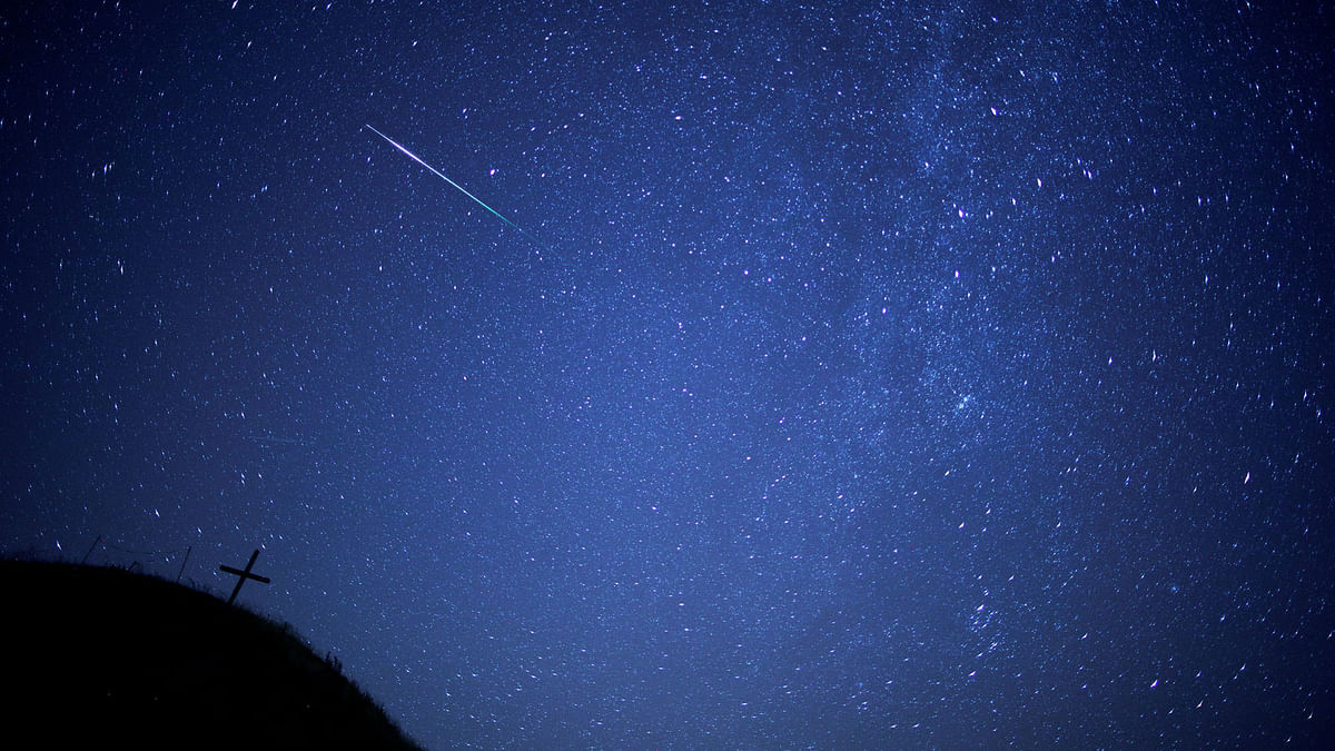 A meteor streaks past the Milky Way in the night sky above Leeberg hill during the Perseid meteor shower in Grossmugl, Austria, on 12 August, 2018. Photo: Reuters