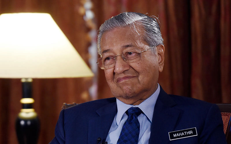 Malaysia’s prime minister Mahathir Mohamad listens during an interview with The Associated Press in Putrajaya, Malaysia, Monday, 13 August 2018. Photo: AP