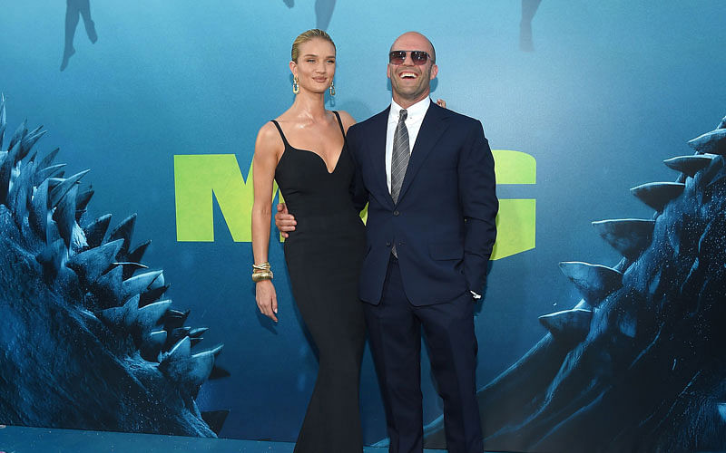 In this file photo taken on 6 August, 2018 British actor Jason Statham and British model Rosie Huntington-Whiteley attend the US premiere of Warner Brothers Pictures “The Meg” in Los Angeles, California. Photo: AFP