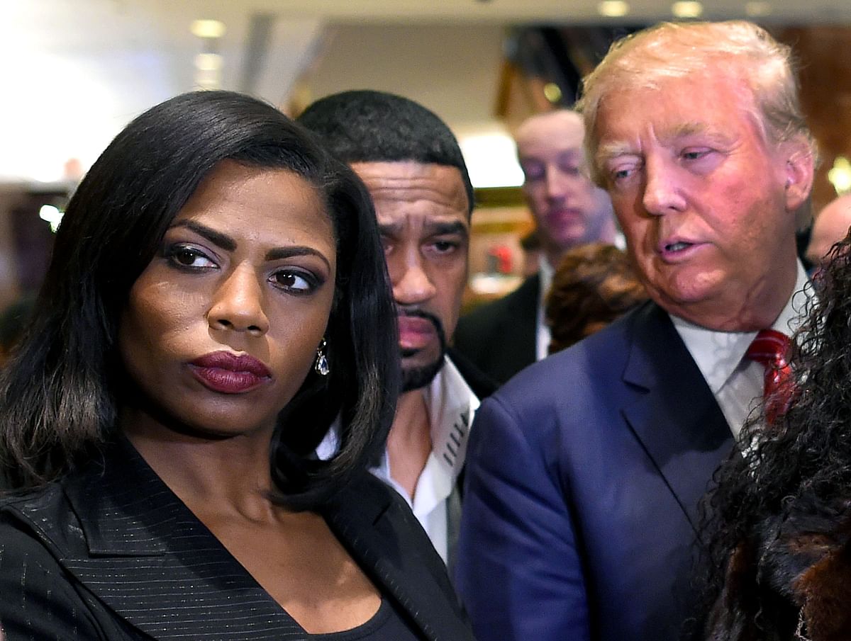 In this file photo taken on 1 December 2015, Omarosa Manigault Newman (L) appears alongside Republican presidential hopeful Donald Trump (R) during a press conference that followed Trump`s meeting with African-American religious leaders in New York. Photo: AFP