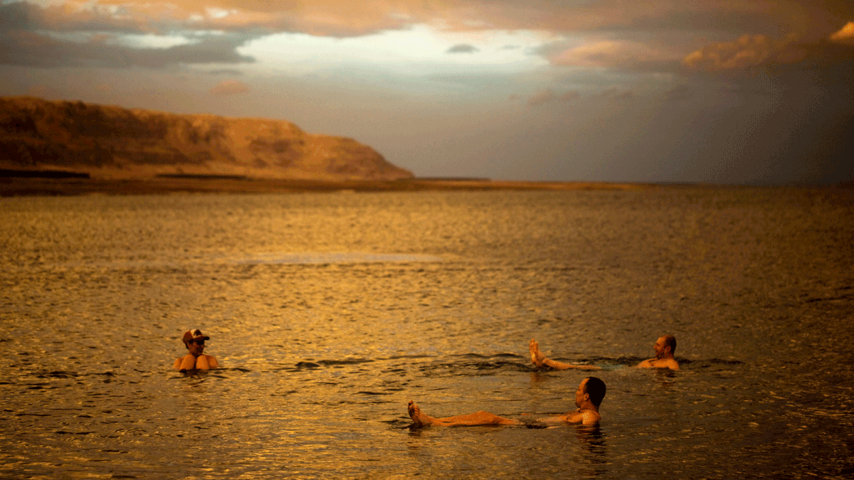 Tourists from Poland float in the Dead Sea during sunset, near Metzoke Dragot in the Israeli occupied West Bank. Photo: Reuters